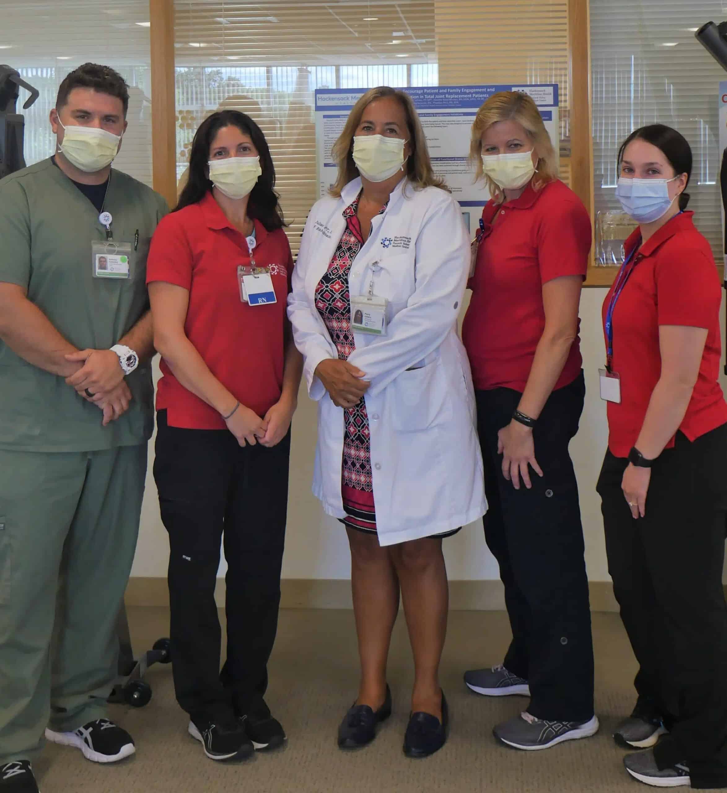 cardiac team posing with face masks on