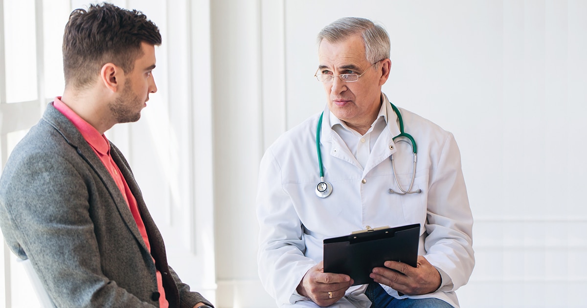 male doctor talking to male patient