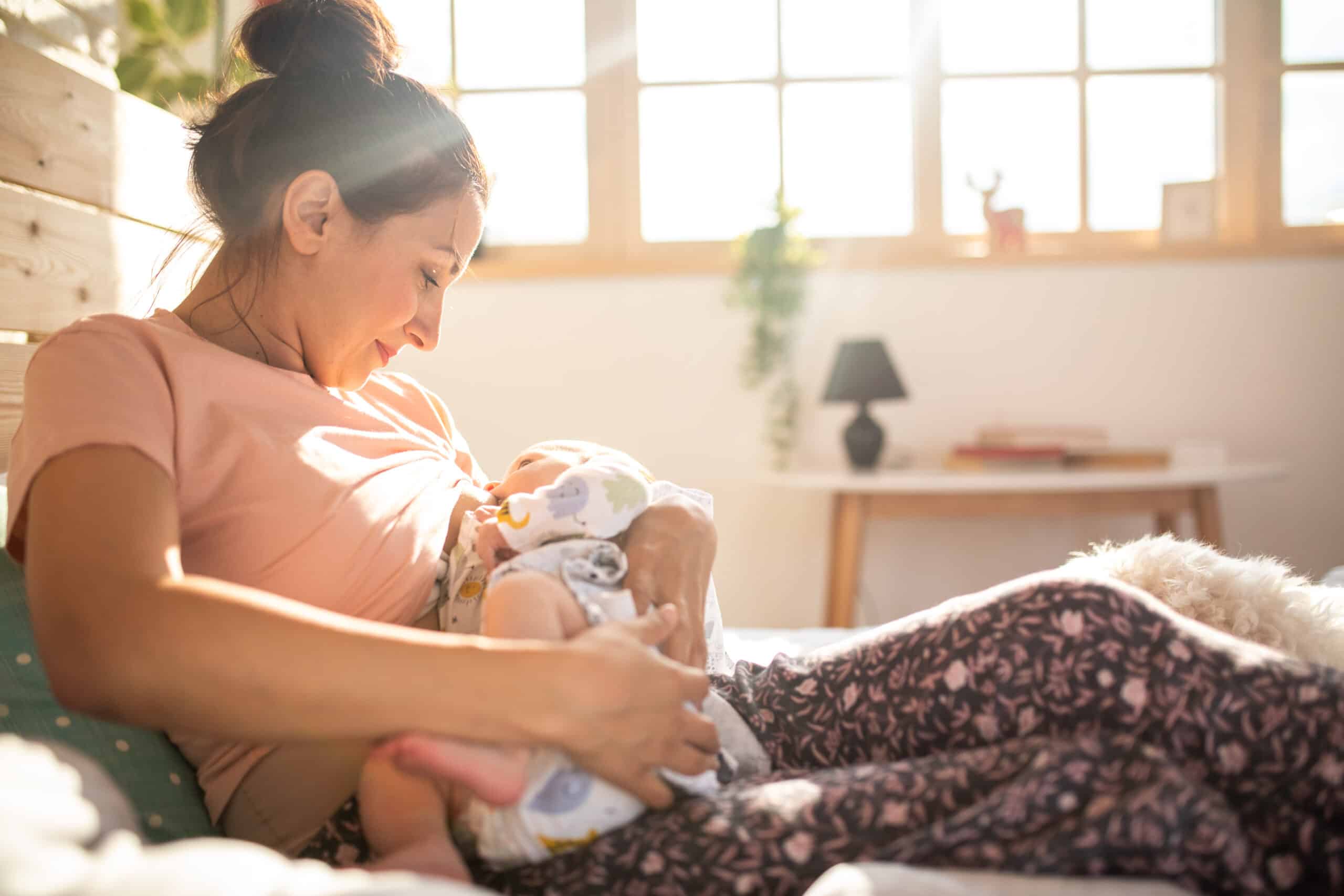 mother breastfeeding newborn