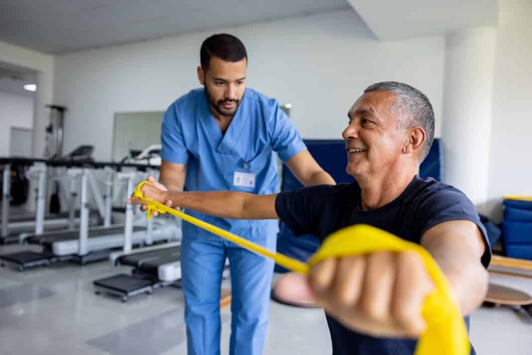 Sports medicine specialist helping a patient rehab from a sports injury.